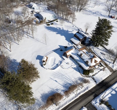Discover a spacious property with expansive outdoor areas, surrounded by winter wonderland views and tranquility.