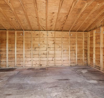 Spacious, empty shed with high ceilings, ready for your storage or creative projects.