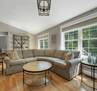Bright, inviting living space featuring abundant natural light and modern furnishings, perfect for relaxation and gatherings.