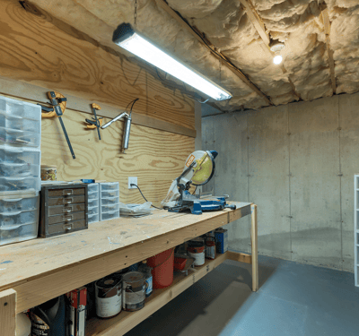 Spacious workshop with ample storage, perfect for DIY projects and organized workspace.