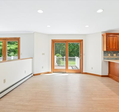 Spacious open-concept living area featuring natural light, premium finishes, and direct access to outdoor space.