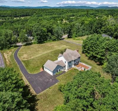 Spacious home on a large lot, surrounded by lush greenery and scenic mountain views. Perfect for tranquility!