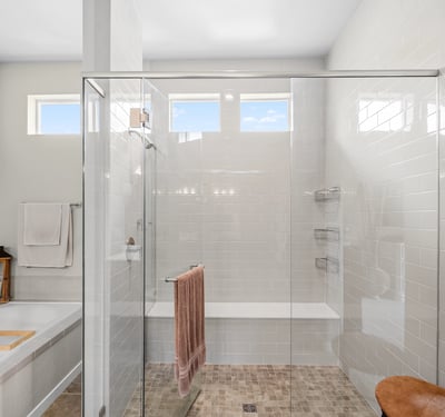 Primary Suite with attached 5 piece bath and walk in closet.