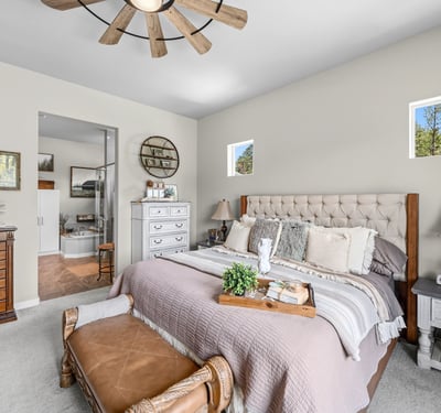 Primary Suite with attached 5 piece bath and walk in closet.