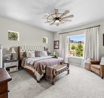 Primary Suite with attached 5 piece bath and walk in closet.