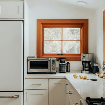 Bright and functional kitchen featuring modern appliances and ample counter space, perfect for culinary enthusiasts.
