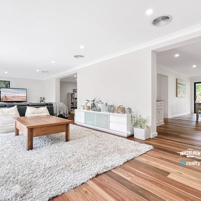 Bright and airy living space with natural light, featuring hardwood floors and an inviting, open layout.