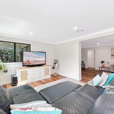 Bright and spacious living area featuring modern furnishings and large windows for natural light.