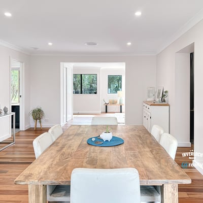 Spacious open-concept living area featuring a modern dining space and abundant natural light throughout.