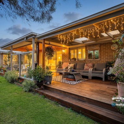 Discover a relaxing outdoor space, ideal for entertaining, with ambient lighting and lush garden views.