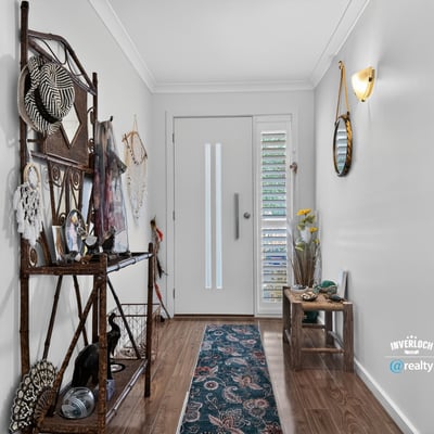 Bright entryway featuring unique decor and ample natural light, perfect for welcoming guests into your home.