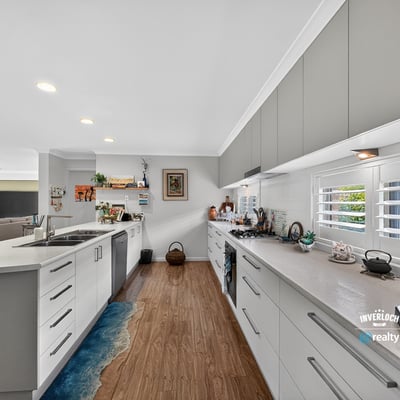 Modern kitchen featuring ample counter space, bright lighting, and a layout ideal for entertaining.