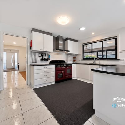Modern kitchen featuring ample cabinetry, a spacious layout, and sleek appliances, perfect for culinary enthusiasts.