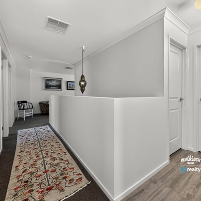 Bright and spacious hallway featuring modern decor and a welcoming atmosphere, perfect for any home.