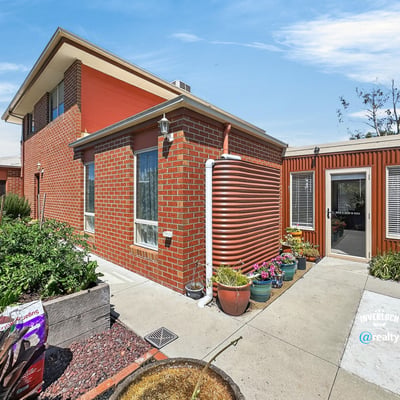 This distinctive home features a unique design, spacious garden, and ample natural light throughout.
