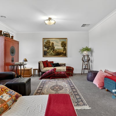 Spacious living area featuring diverse seating options and artwork, perfect for relaxation and gatherings.