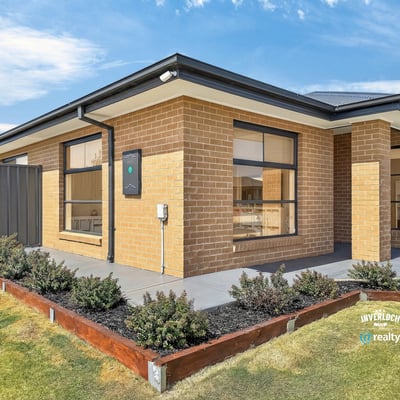 Modern brick home featuring clean lines and ample outdoor space for family gatherings and activities.
