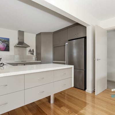 Modern kitchen features sleek cabinetry and a functional layout, perfect for culinary enthusiasts and entertaining.