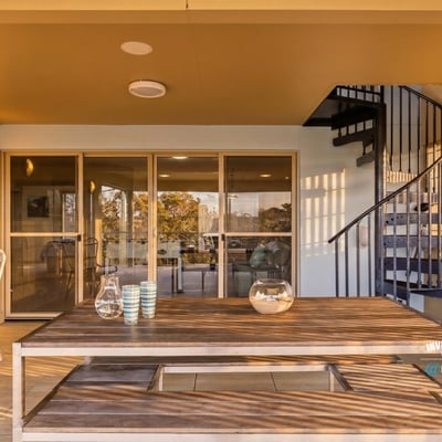 Spacious outdoor patio featuring a spiral staircase, perfect for entertaining and enjoying panoramic views.