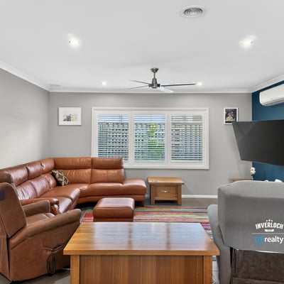 Spacious living area featuring a modern layout, comfortable seating, and abundant natural light throughout.