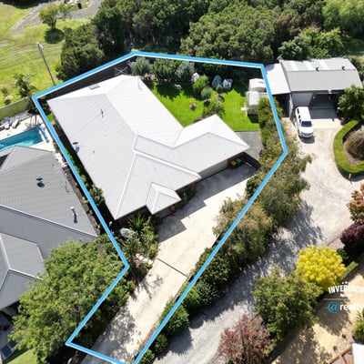 Spacious property featuring a lush yard, pool, and ample parking with a functional layout.