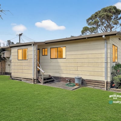 This spacious home features a generous yard, ideal for outdoor activities and gatherings.
