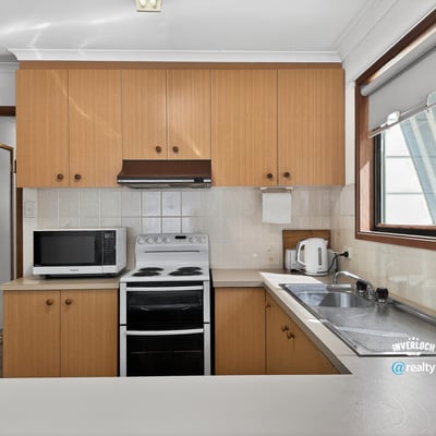 Bright kitchen features modern appliances and ample counter space, perfect for everyday cooking and entertaining.