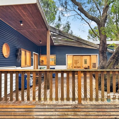 Discover this unique home featuring an open deck, contemporary design, and natural surroundings for optimal outdoor living.
