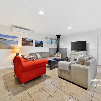 Bright and inviting living space featuring a cozy fireplace, modern furnishings, and ample natural light.