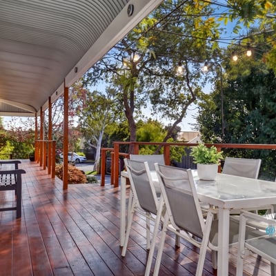 Relax on this expansive deck with captivating views and ample space for entertaining family and friends.