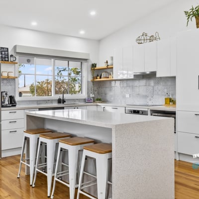 Bright, modern kitchen featuring sleek cabinetry, stainless steel appliances, and a spacious island for entertaining.