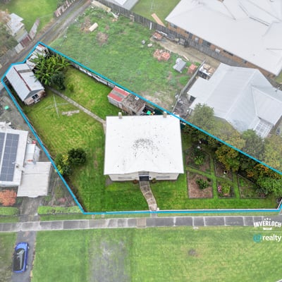 Spacious property featuring a large yard, multiple outbuildings, and convenient access to local amenities.
