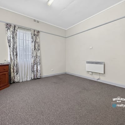 Bright, versatile room featuring ample natural light and neutral tones, perfect for various layout possibilities.