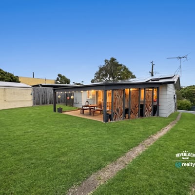 Discover this unique property featuring a spacious yard and modern outdoor living space, perfect for entertaining.