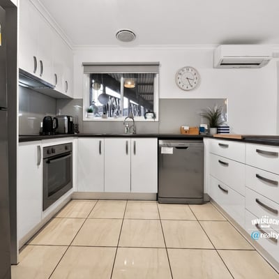 Modern kitchen featuring ample storage, stainless steel appliances, and a spacious layout for culinary creativity.