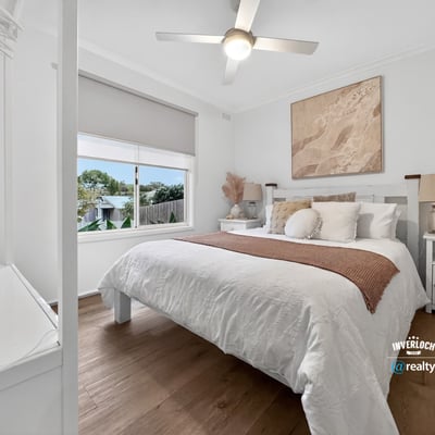 This inviting bedroom features a spacious layout, abundant natural light, and contemporary decor for comfortable living.