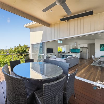 Experience seamless indoor-outdoor living with this inviting patio and expansive views of the surrounding greenery.
