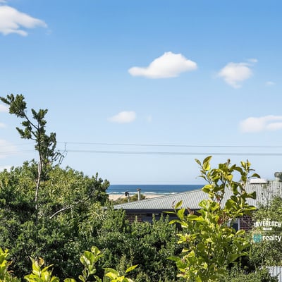 Enjoy stunning coastline views from this elevated property, surrounded by lush greenery and peaceful ambiance.