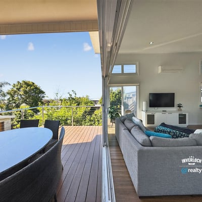 Bright and spacious indoor-outdoor living area with scenic views, perfect for entertaining and relaxation.