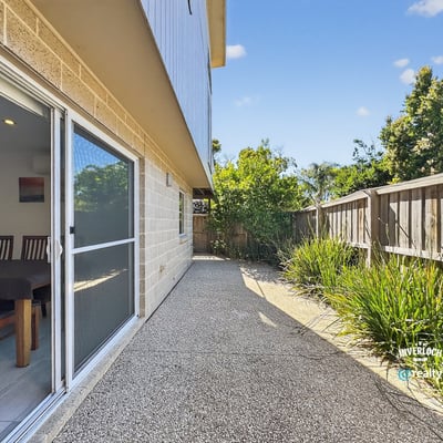 Spacious outdoor area offers a low-maintenance retreat, perfect for lounging or entertaining guests.