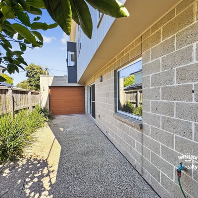 Contemporary home featuring a unique façade, private driveway, and landscaped outdoor space. Perfect for modern living.