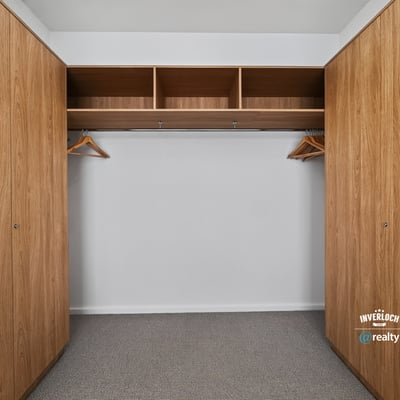Spacious closet featuring ample storage with built-in shelving and hanging options for efficient organization.