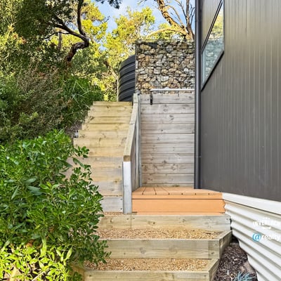 Discover this unique outdoor entrance featuring modern design elements and natural landscaping for easy accessibility.
