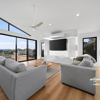 Bright and airy living space featuring large windows that showcase stunning outdoor views and modern design.