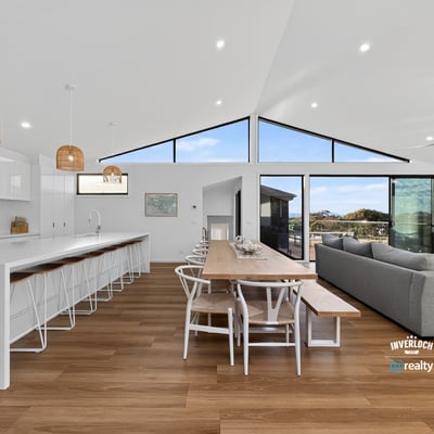 Spacious open-concept living area with modern finishes and abundant natural light, perfect for entertaining.