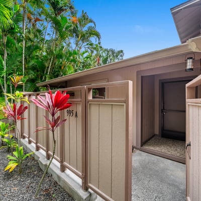 Discover a tranquil retreat featuring lush landscaping and a welcoming entrance, perfect for relaxed living.