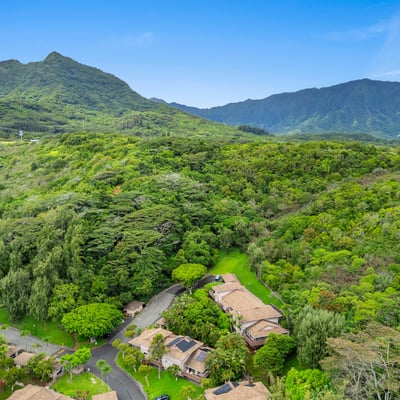 Discover this hillside retreat surrounded by lush greenery and stunning mountain views, offering privacy and tranquility.