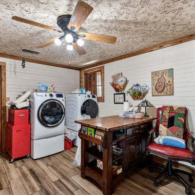 Bright laundry room features ample workspace for everyday tasks.