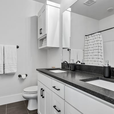 Upstairs Bathroom with Dual Vanity, Linin Closet, and Tub/Shower Combo