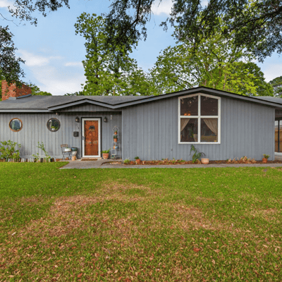 Spacious home with distinctive architecture and a landscaped yard, perfect for comfortable living and entertaining.